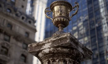 a winner's cup on a corroded post 