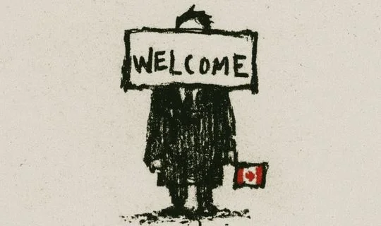 a man holding a Canadian flag with a welcome sign across his face