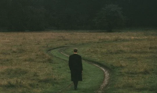 a banker on a country road going nowhere