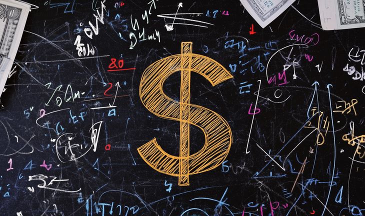 Dollar sign on a blackboard