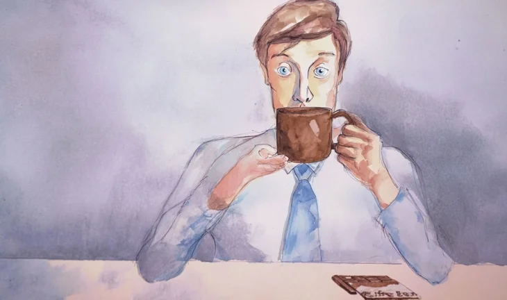 a banker eating a cup of coffee with chocolate on the table