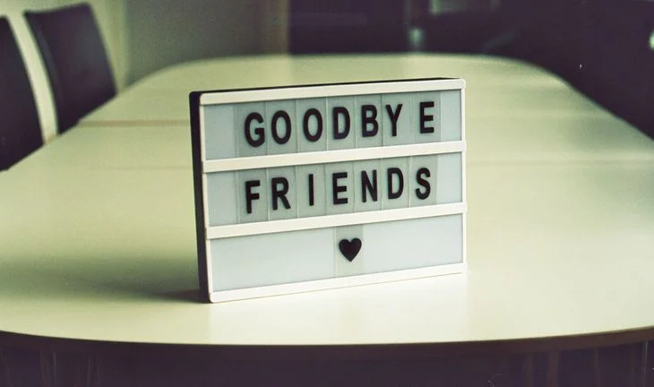 a sign saying goodbye friends
