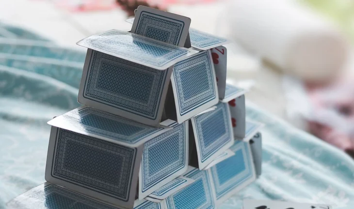a house of cards, quite small, blue
